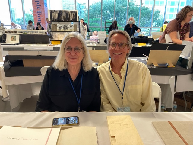 CB Sherlock and Tom Virgin (teacher and student) fair neighbors and close friends, enjoy a brief break in the very well attended and soon to celebrated gathering of sixty plus book artists from around the U.S. and the world.