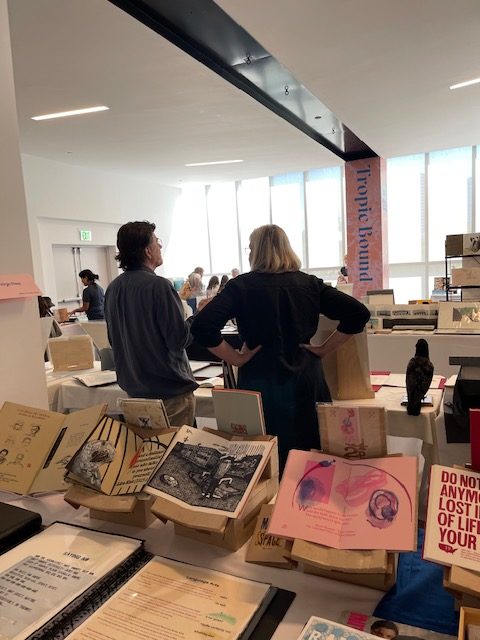 CB Sherlock & Gaylord Schanilec, Minnesota printers and mentors to Tom Virgin/ Extra Virgin Press getting ready for another day at Paradise Plaza's third floor event space at Tropic Bound Artists' Book Fair.